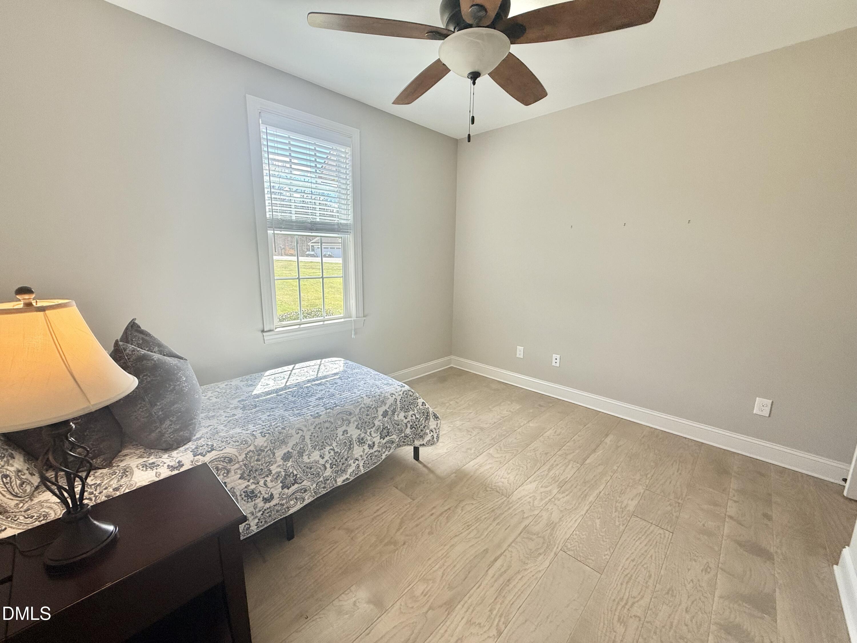 128 Bessie Lane Roxboro, NC 27574 - Photo 36 of 55 a bedroom with a bed and a window
