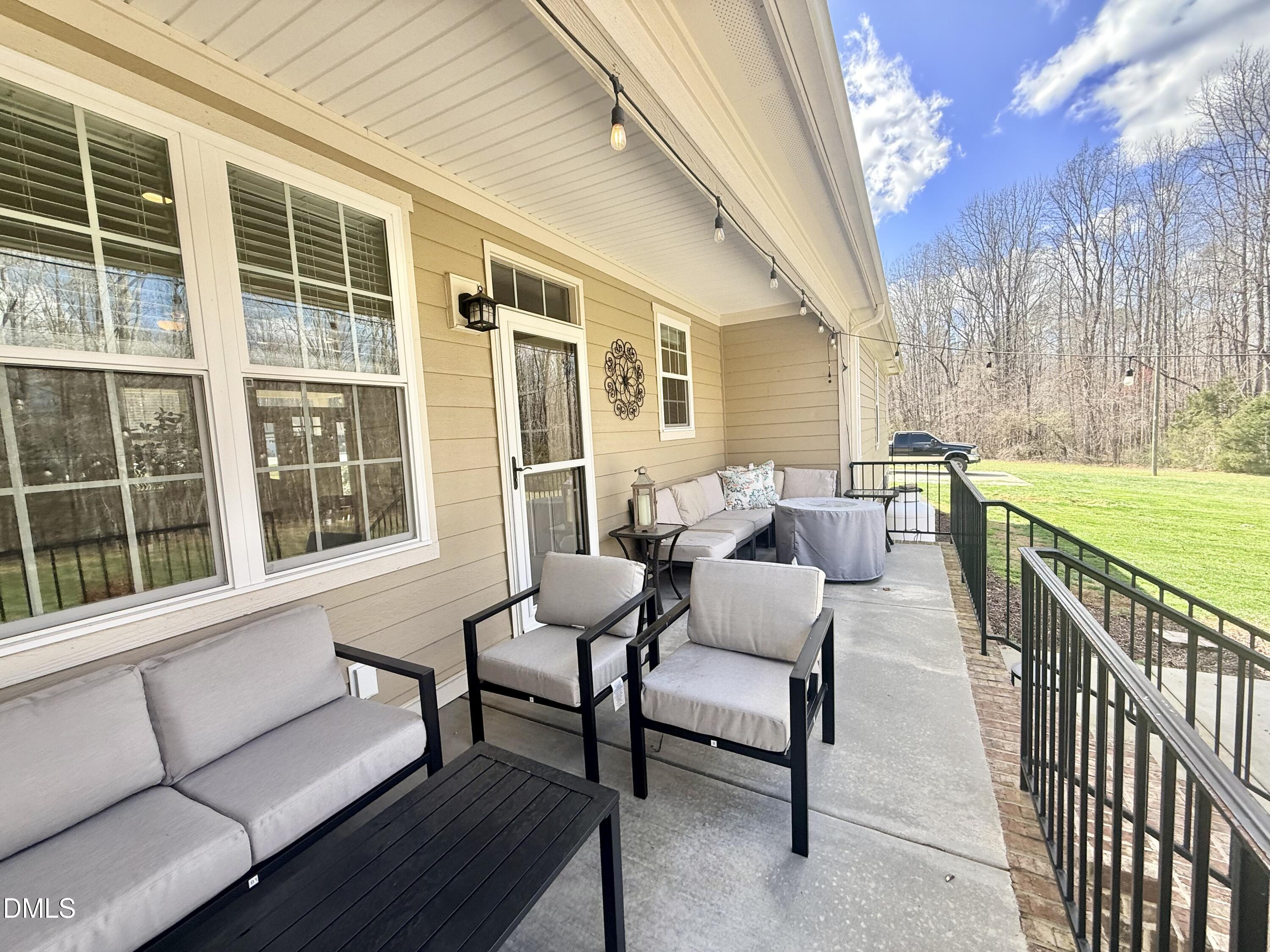 128 Bessie Lane Roxboro, NC 27574 - Photo 46 of 55 a balcony with furniture and outdoor seating