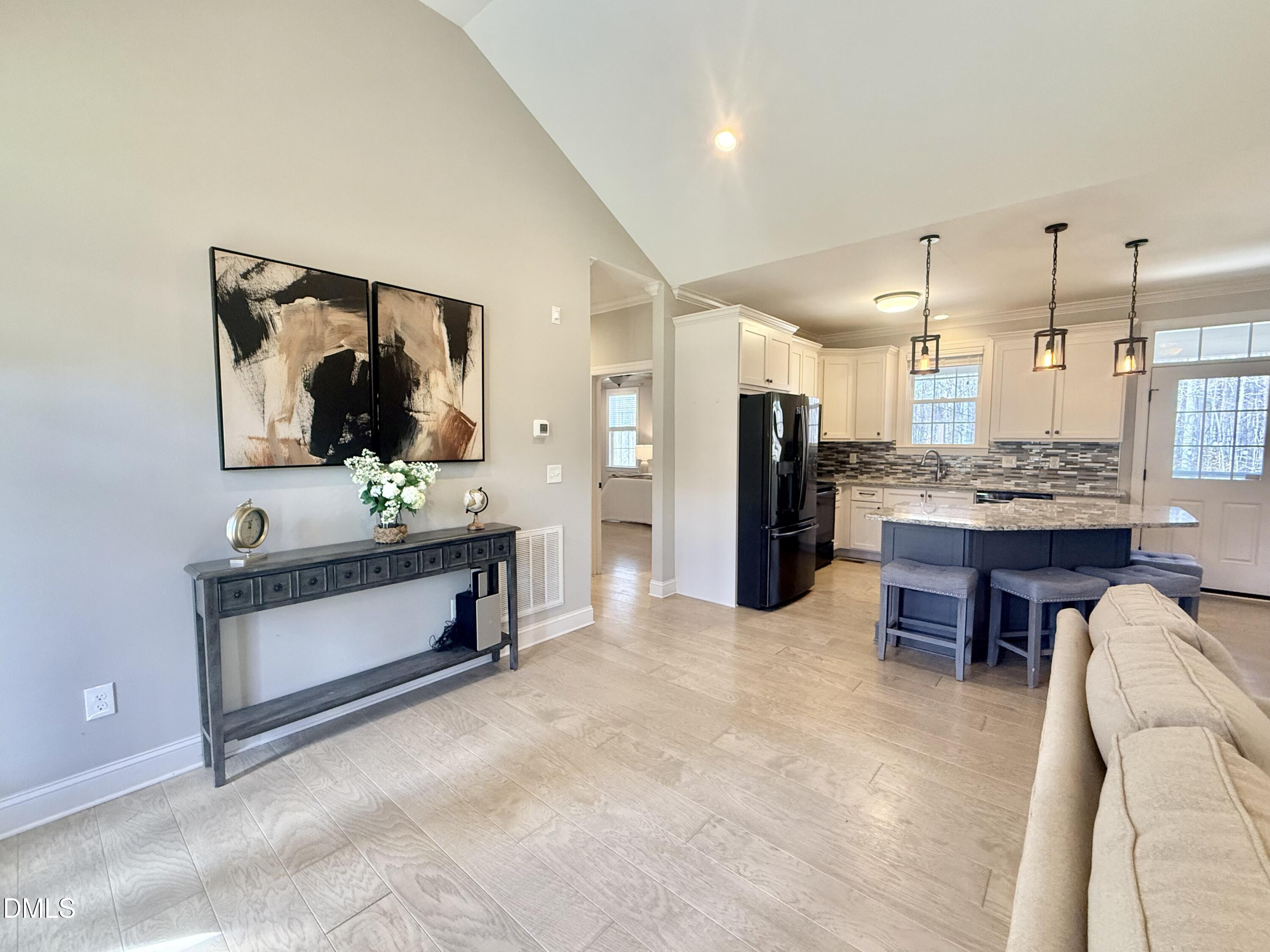 128 Bessie Lane Roxboro, NC 27574 - Photo 5 of 55 a living room with stainless steel appliances kitchen island furniture and a kitchen view