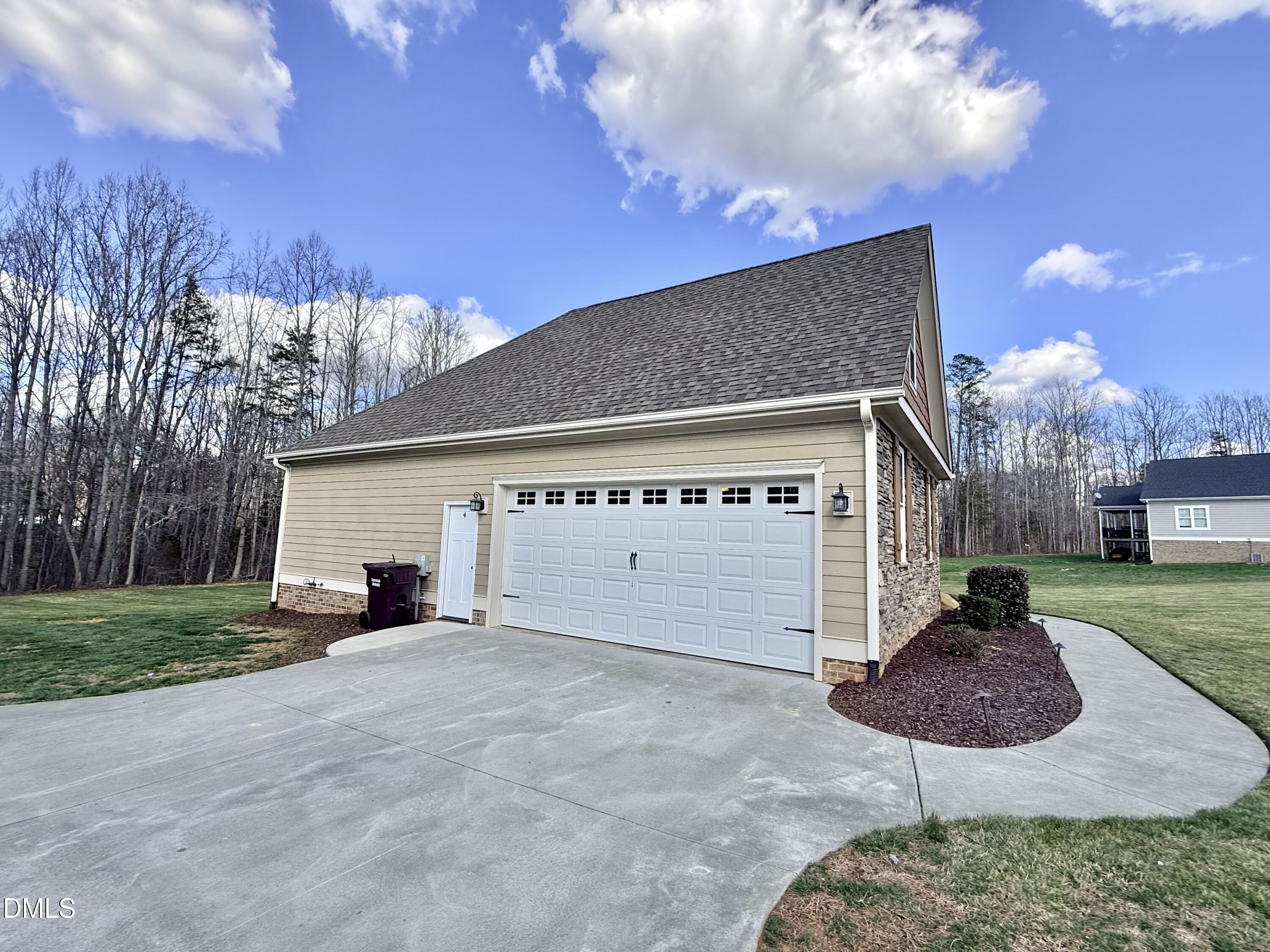 128 Bessie Lane Roxboro, NC 27574 - Photo 53 of 55 a view of a house with backyard and trees