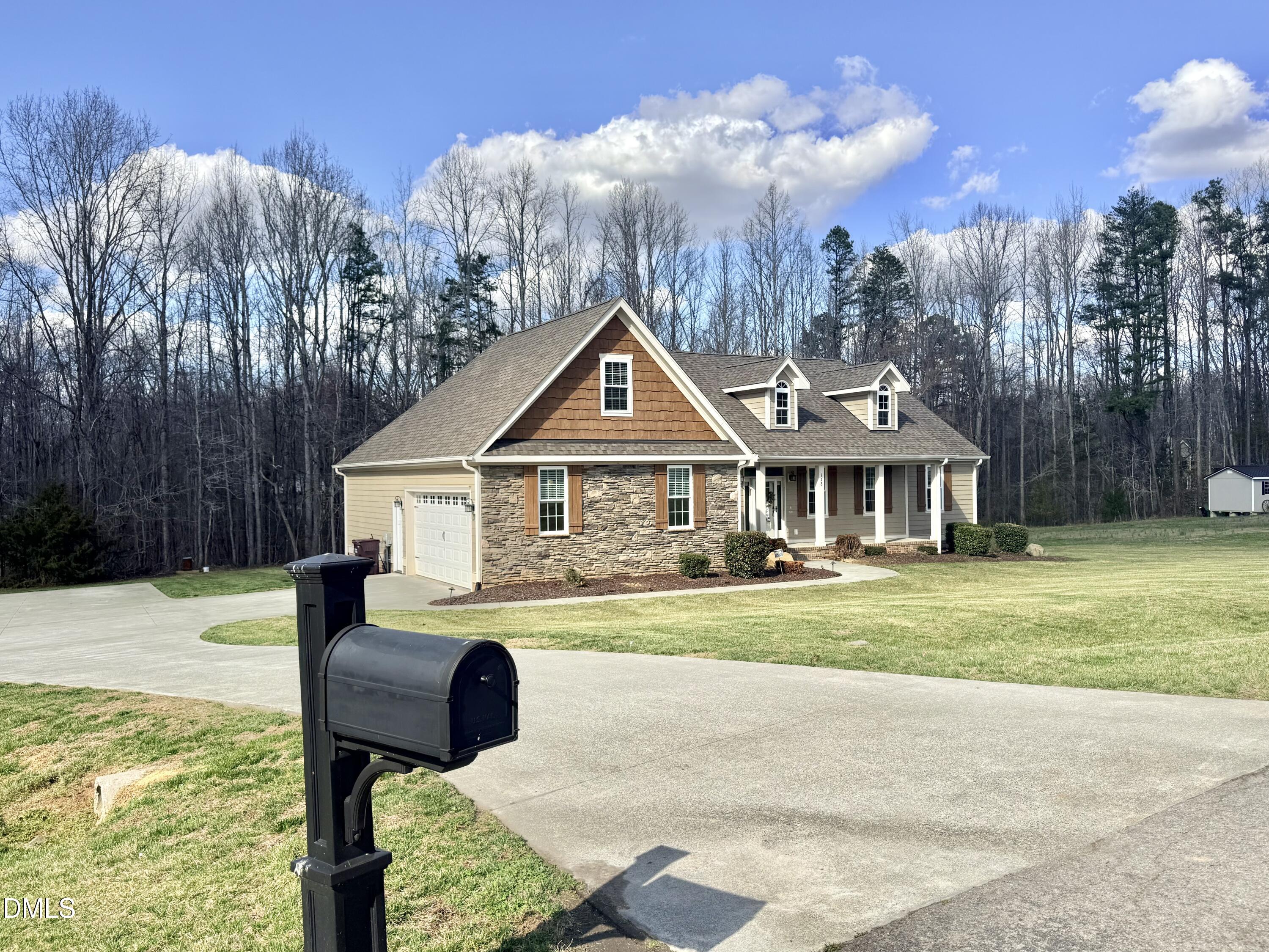 128 Bessie Lane Roxboro, NC 27574 - Photo 54 of 55 a front view of a house with garden
