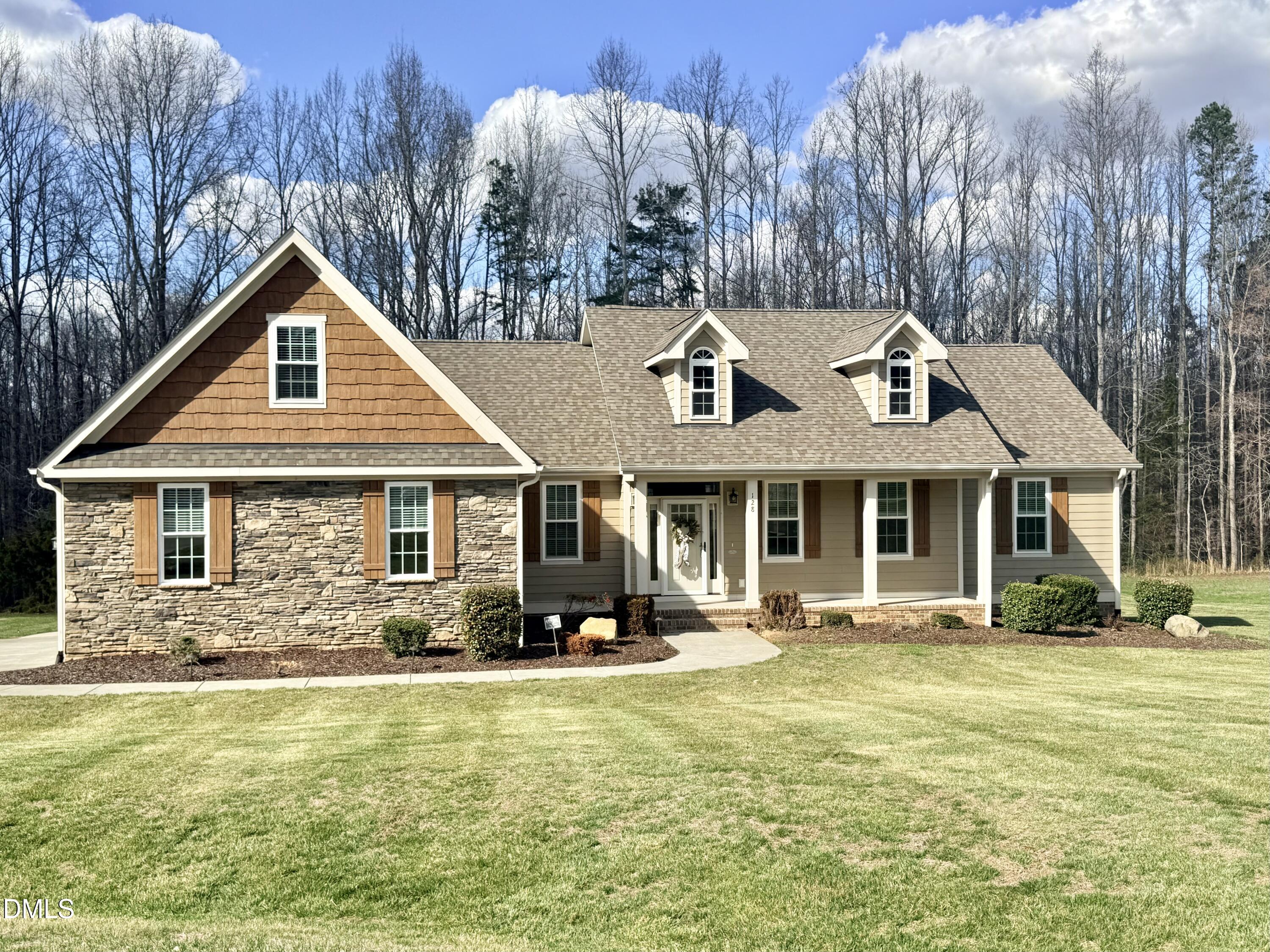 128 Bessie Lane Roxboro, NC 27574 - Photo 55 of 55 a front view of house with yard outdoor seating and covered with trees