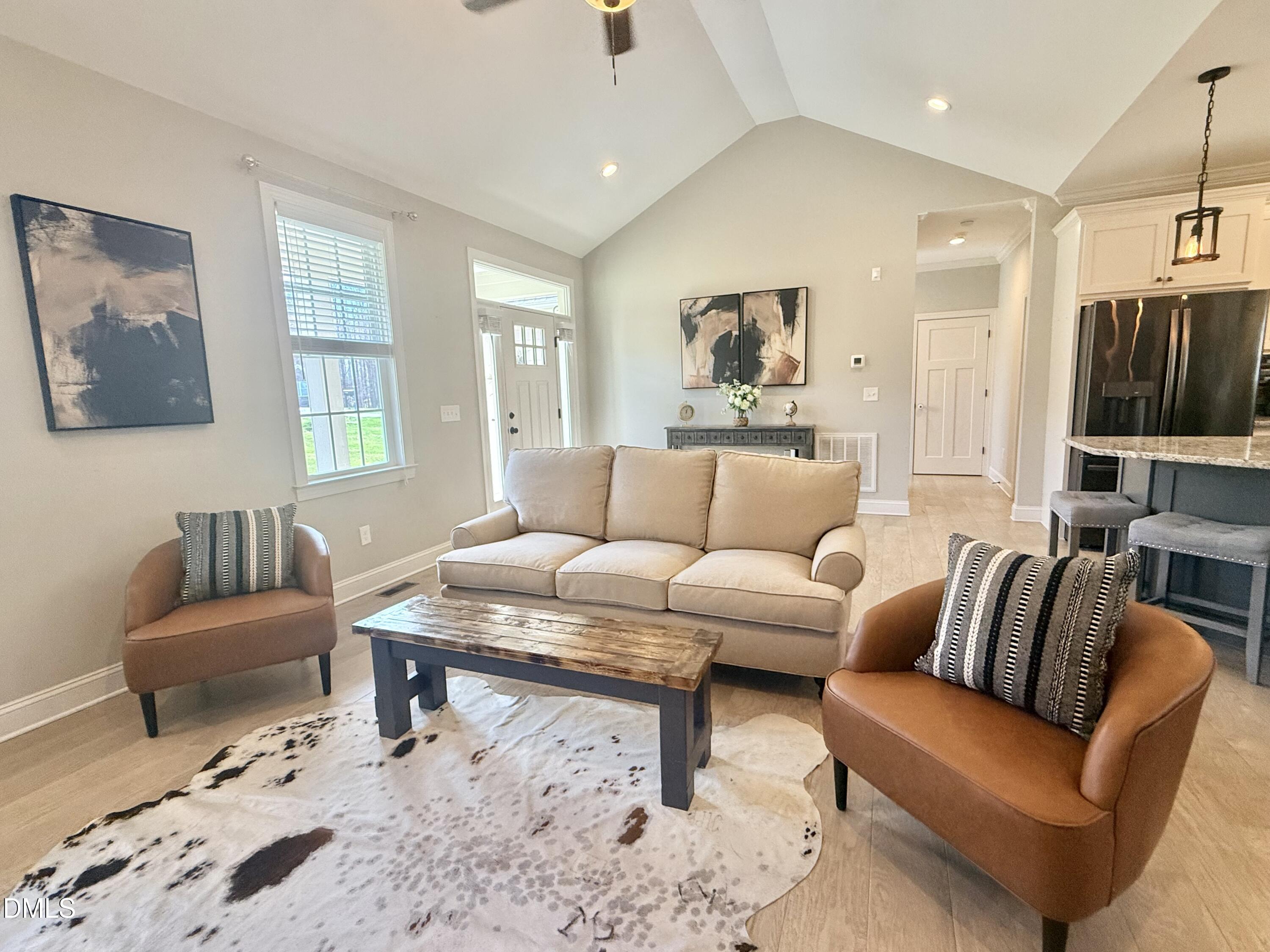 128 Bessie Lane Roxboro, NC 27574 - Photo 7 of 55 a living room with furniture and a flat screen tv