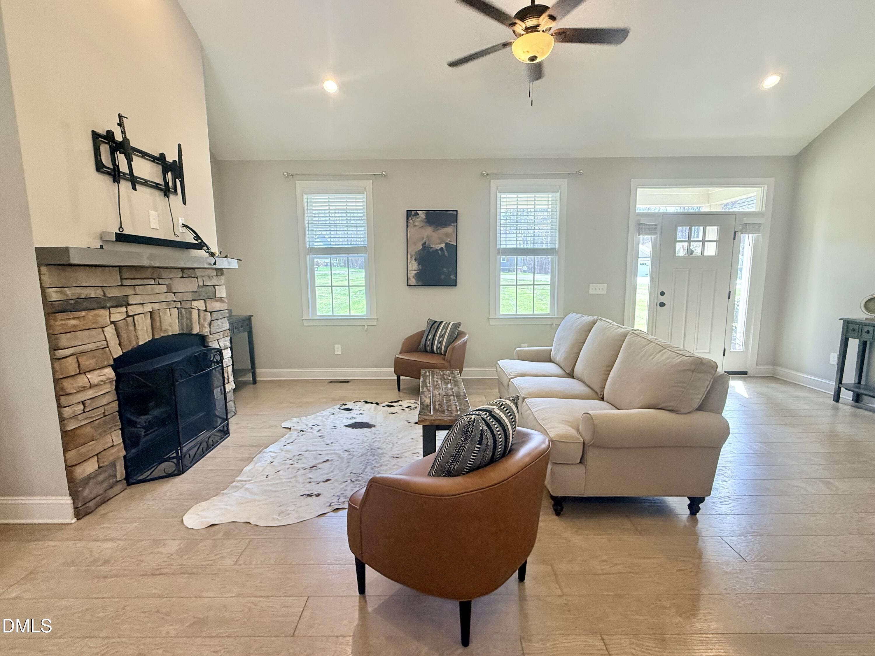 128 Bessie Lane Roxboro, NC 27574 - Photo 8 of 55 a living room with furniture and a fireplace