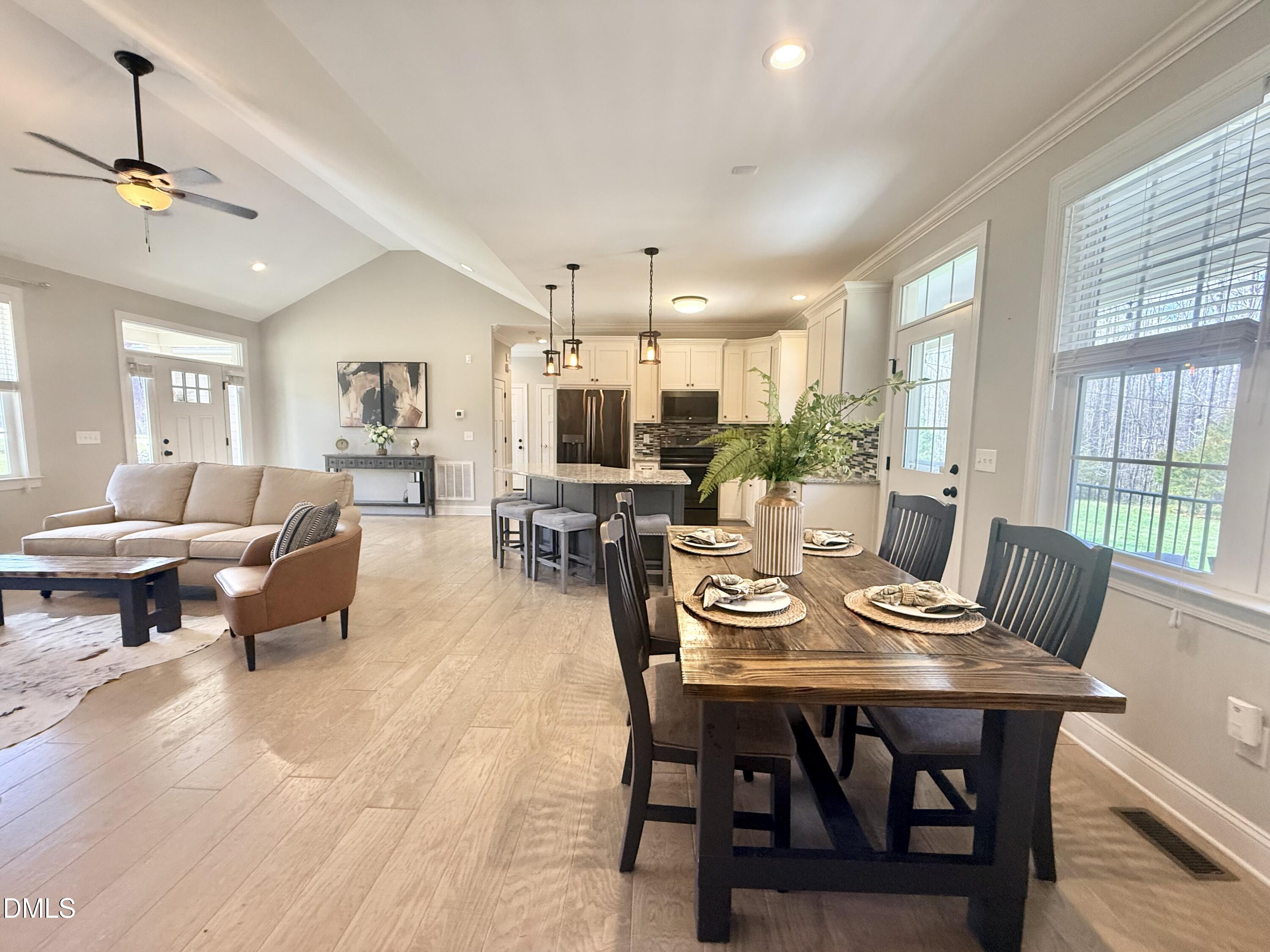 128 Bessie Lane Roxboro, NC 27574 - Photo 10 of 55 a view of a dining room with furniture window and wooden floor