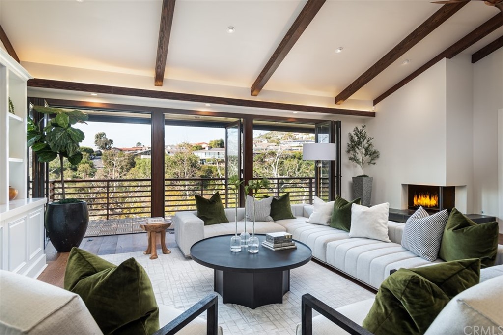 247 Emerald Bay Laguna Beach, CA 92651 - Photo 14 of 47 a living room with furniture and a large window
