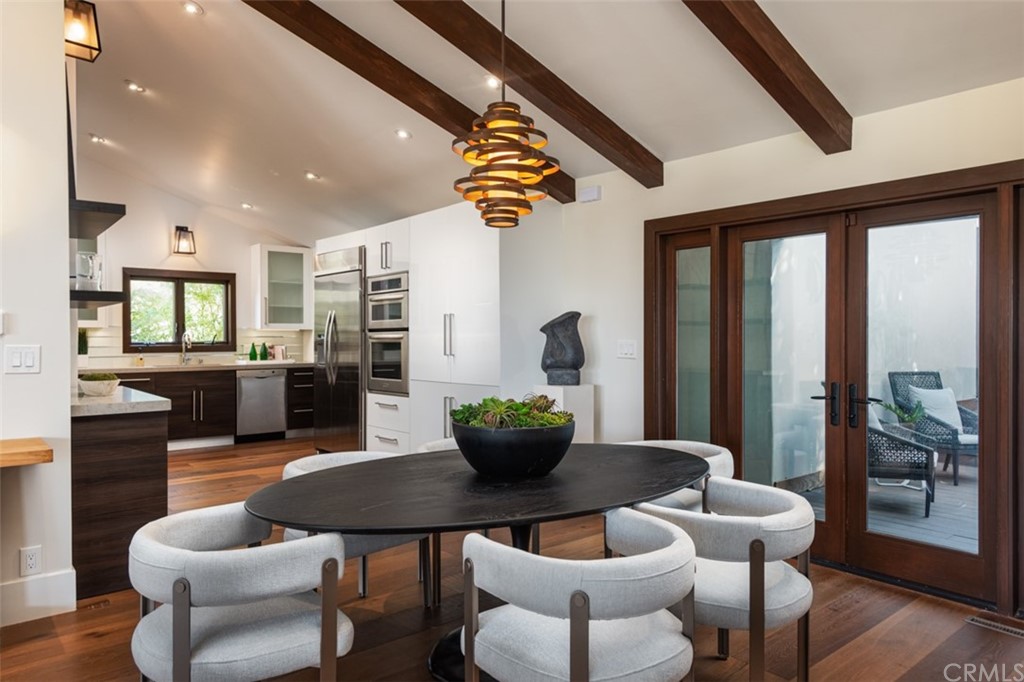 247 Emerald Bay Laguna Beach, CA 92651 - Photo 18 of 47 a dining room with furniture and wooden floor
