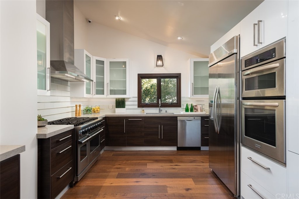247 Emerald Bay Laguna Beach, CA 92651 - Photo 19 of 47 a kitchen with a sink stove and refrigerator