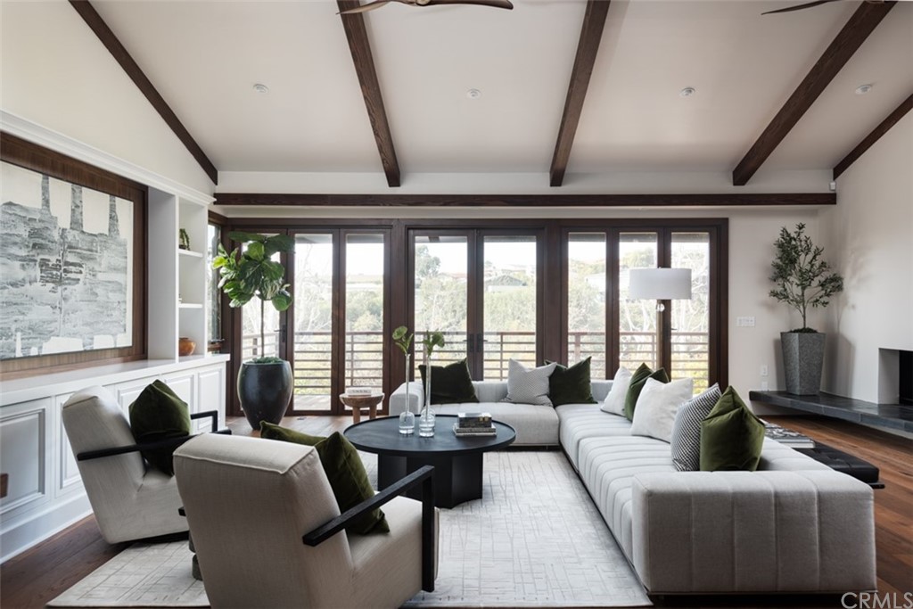 247 Emerald Bay Laguna Beach, CA 92651 - Photo 42 of 47 a living room with furniture and floor to ceiling windows