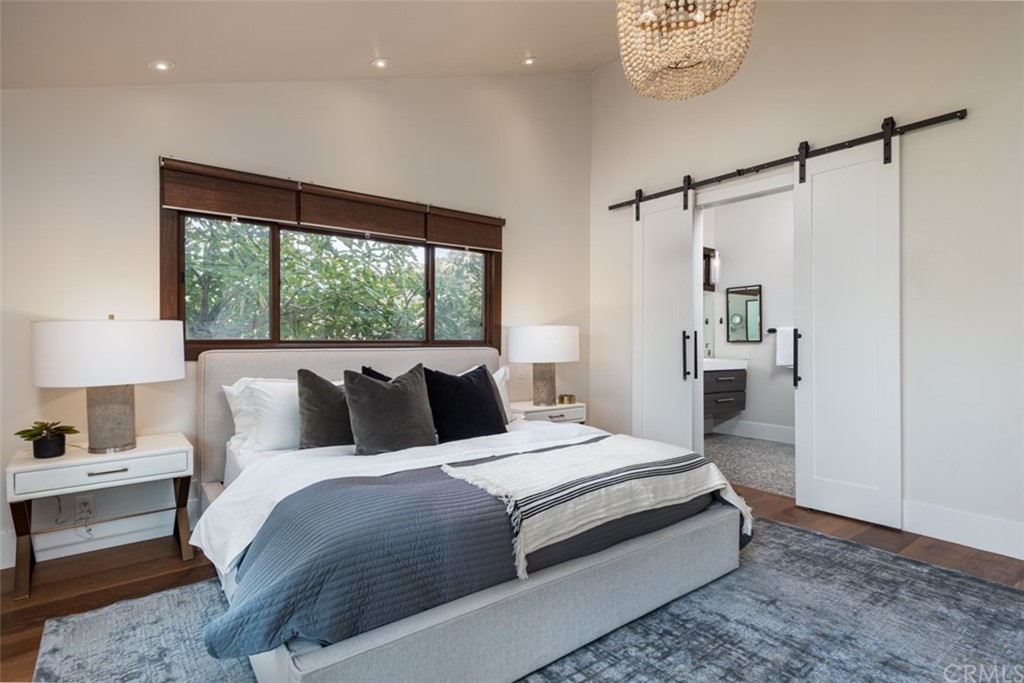 247 Emerald Bay Laguna Beach, CA 92651 - Photo 9 of 47 a bedroom with a bed and a window