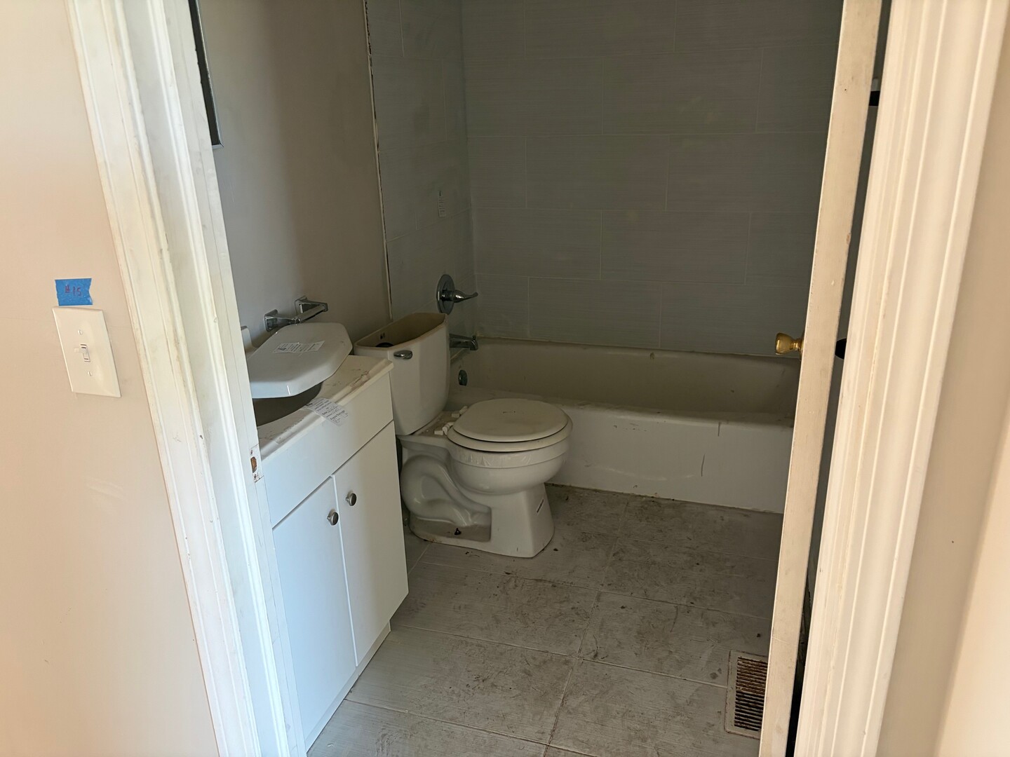 850 West 86th Place Chicago, IL 60620 - Photo 11 of 25 a bathroom with a toilet and a sink