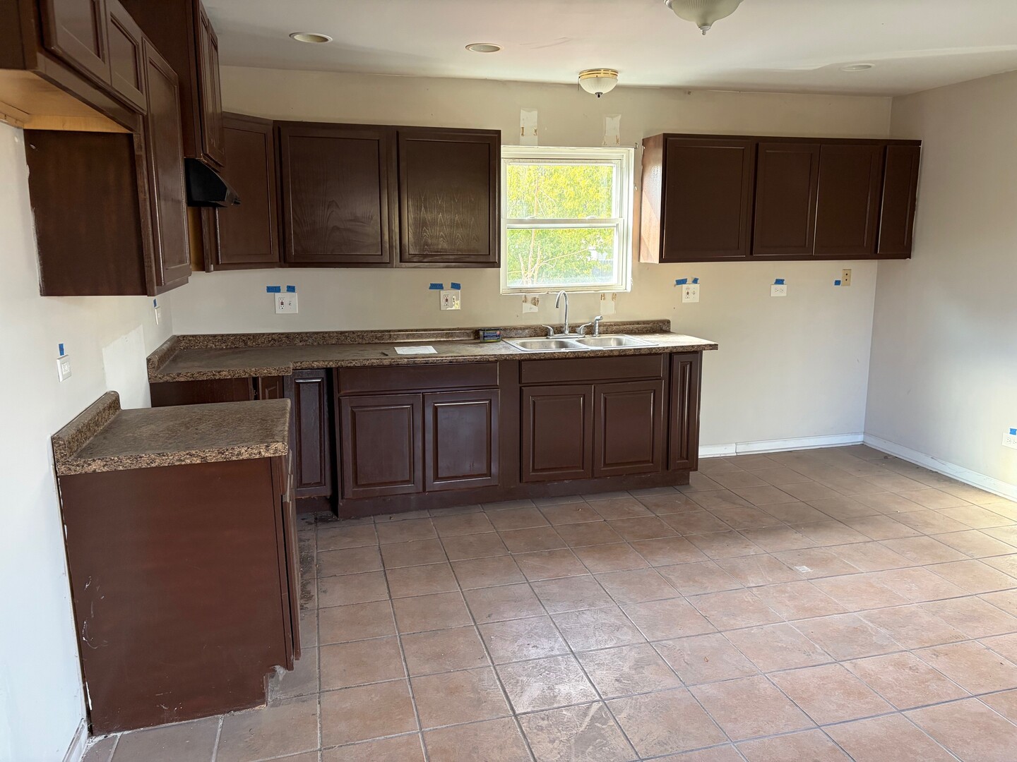 850 West 86th Place Chicago, IL 60620 - Photo 7 of 25 a kitchen with stainless steel appliances granite countertop a stove a sink and a microwave
