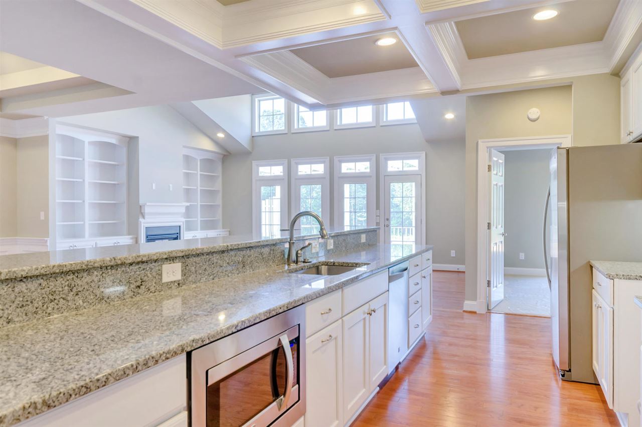 2630 South Bennington Road Charlottesville, VA 22901 - Photo 5 of 18 a kitchen with granite countertop a sink and a wooden floor