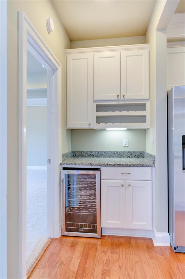 2630 South Bennington Road Charlottesville, VA 22901 - Photo 6 of 18 a kitchen with granite countertop a stove and a wooden cabinets