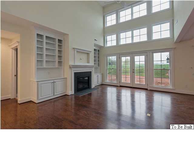 2630 South Bennington Road Charlottesville, VA 22901 - Photo 7 of 18 a black and white living room with wooden floor and a fireplace