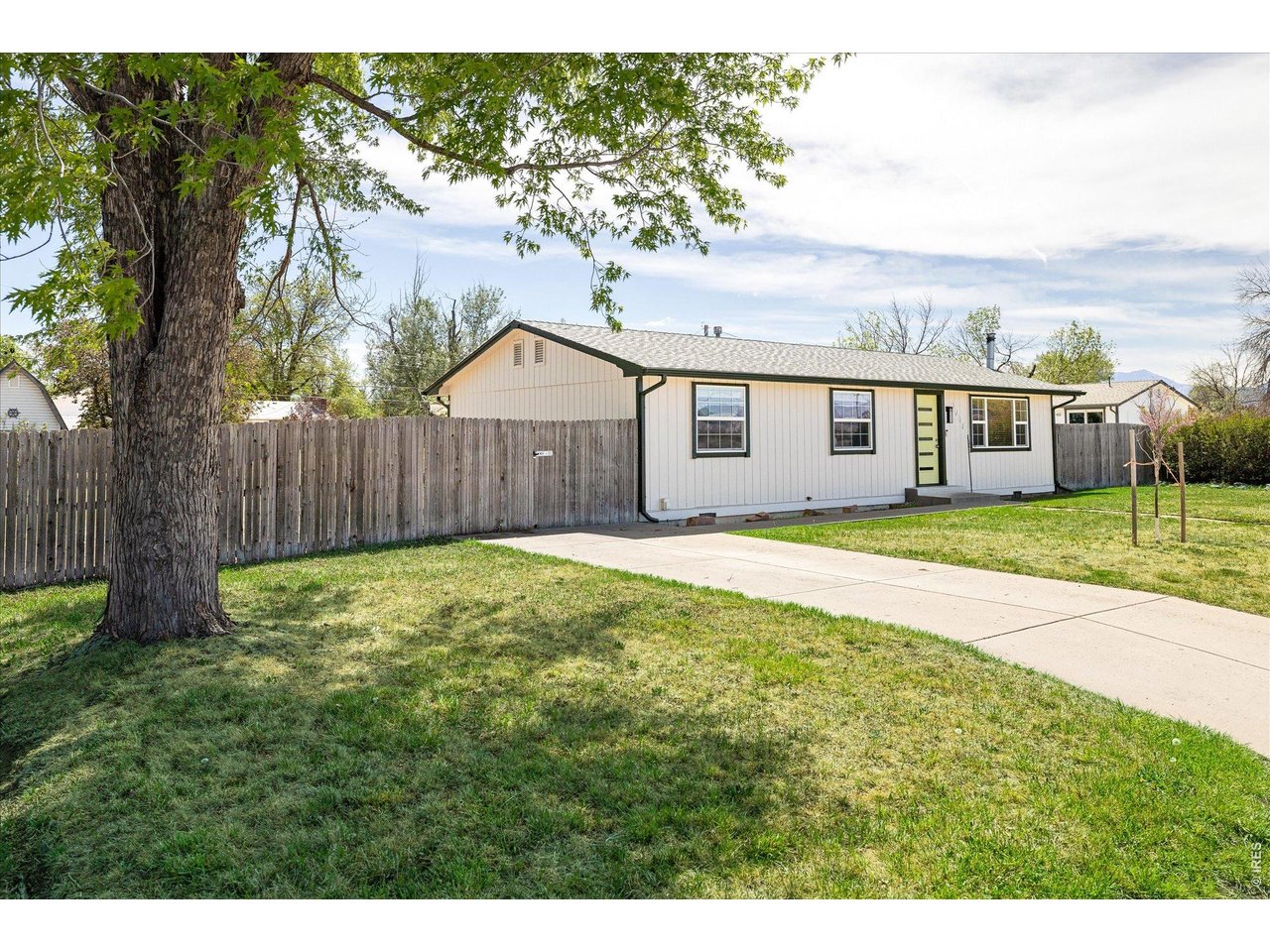 9234 Arapahoe Road Boulder, CO 80303 - Photo 7 of 37 charming single-level home with mature shade tree, spacious front yard and extended driveway for ample off-street parking