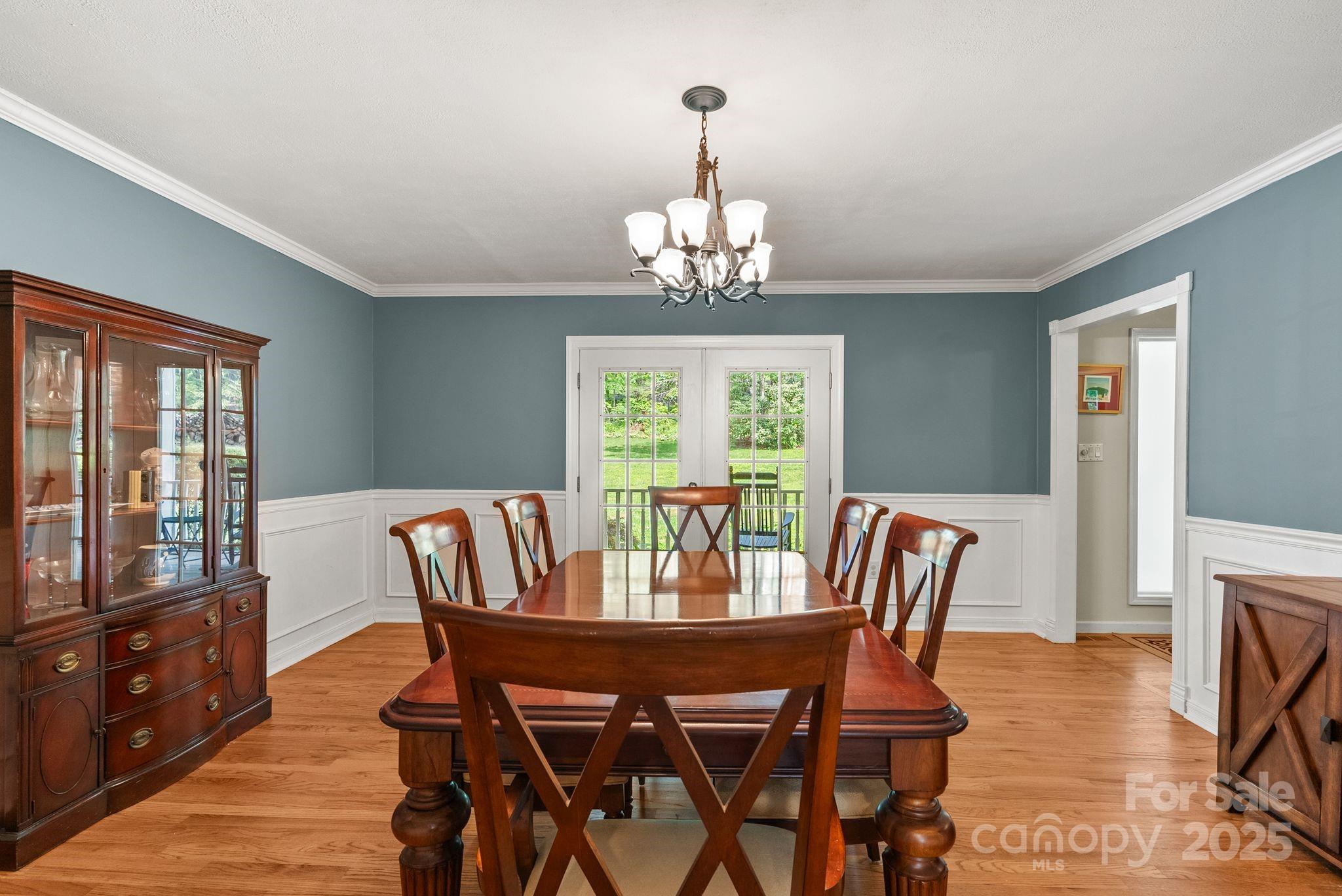 41 Glen Cove Road Arden, NC 28704 - Photo 14 of 39 a view of a dining room with furniture window and wooden floor