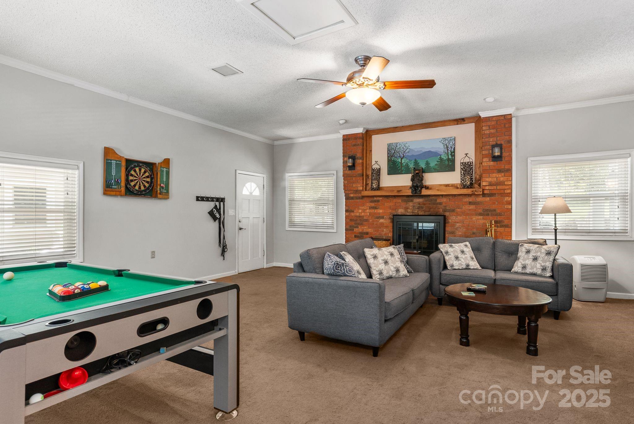 41 Glen Cove Road Arden, NC 28704 - Photo 20 of 39 a living room with furniture and a flat screen tv