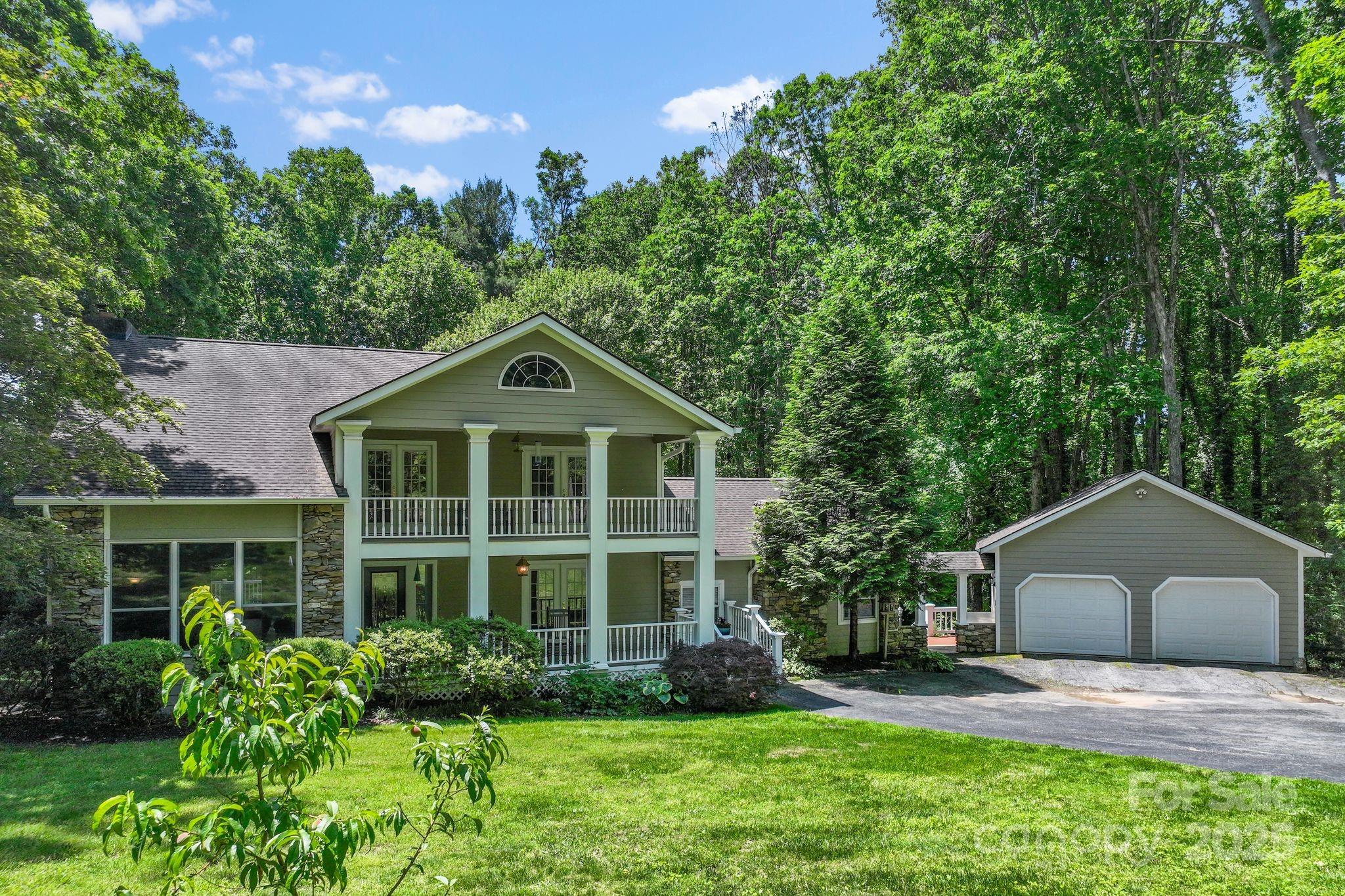 41 Glen Cove Road Arden, NC 28704 - Photo 2 of 39 a front view of a house with a yard and porch