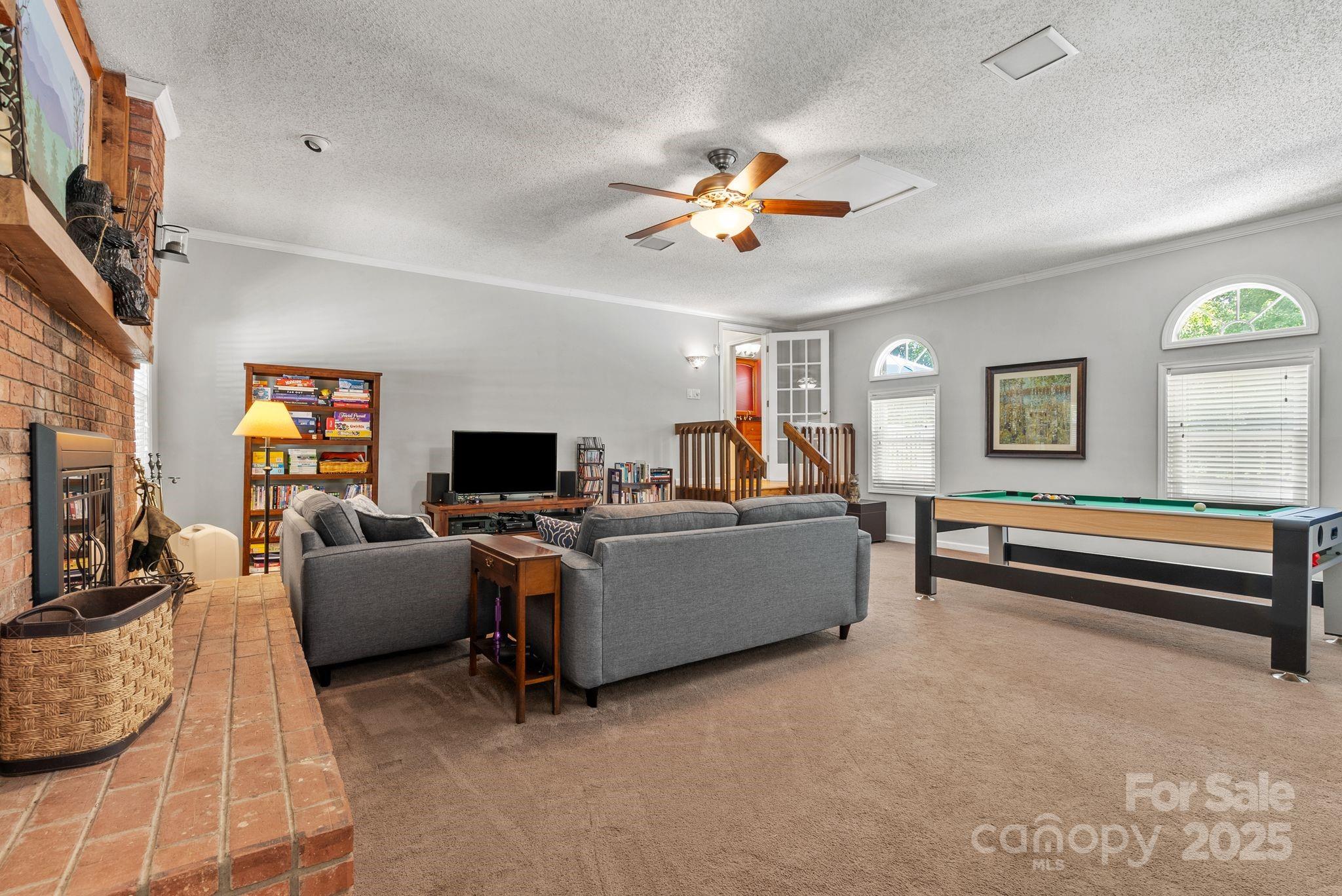 41 Glen Cove Road Arden, NC 28704 - Photo 21 of 39 a living room with furniture and a flat screen tv