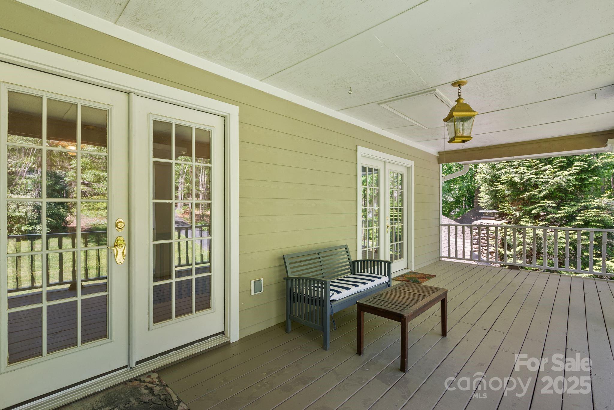 41 Glen Cove Road Arden, NC 28704 - Photo 30 of 39 a balcony with wooden floor and glass door