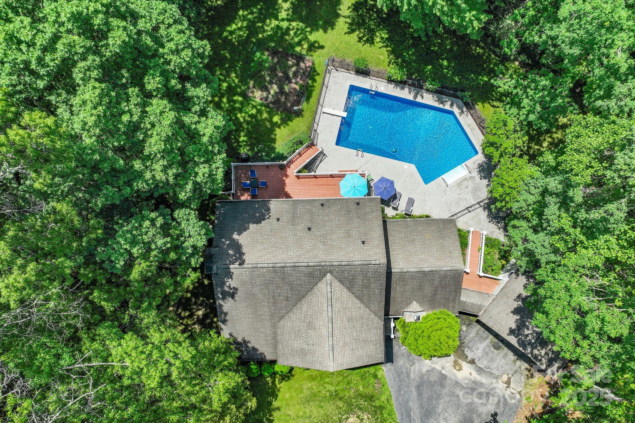 41 Glen Cove Road Arden, NC 28704 - Photo 3 of 39 an aerial view of a house with yard and swimming pool