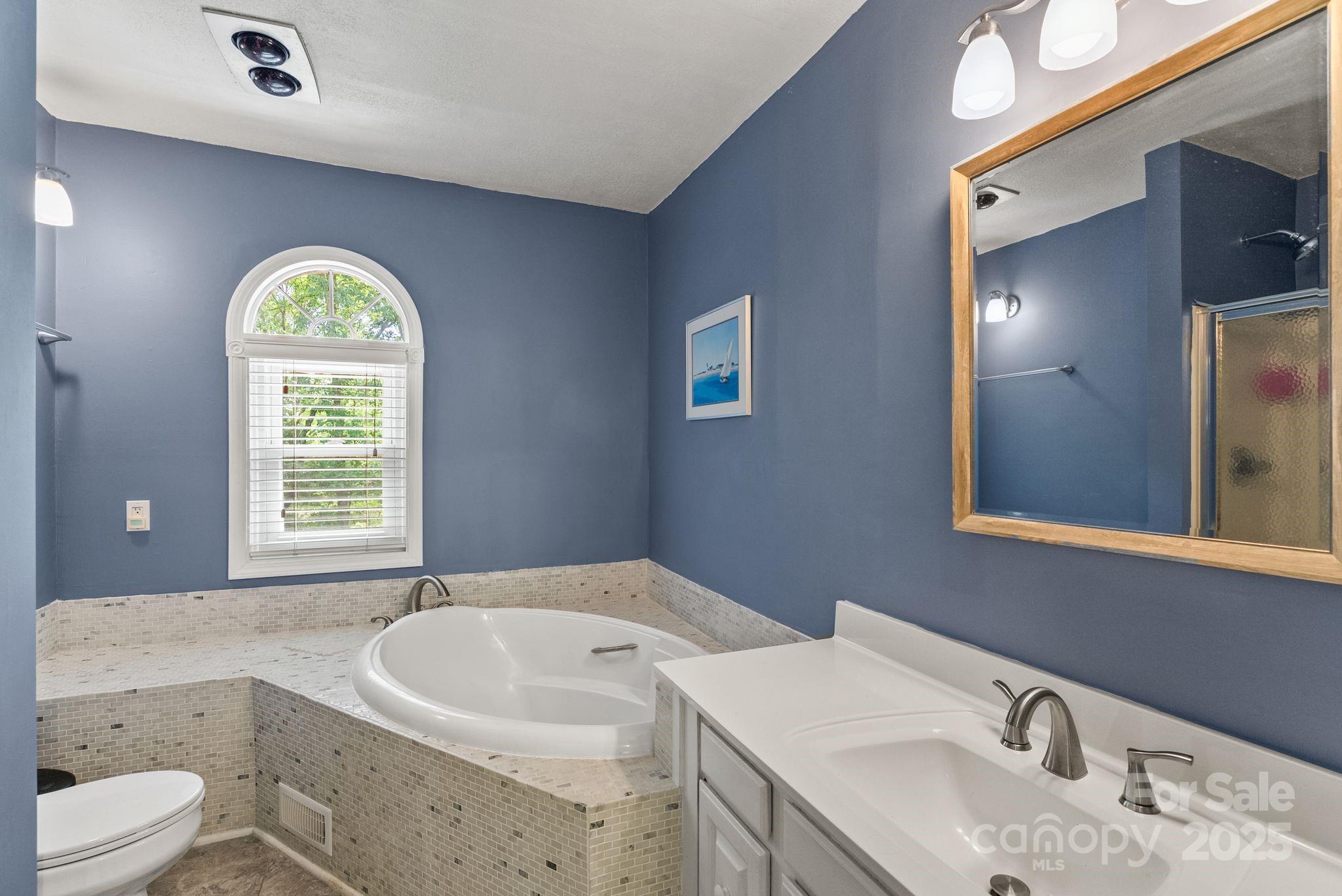 41 Glen Cove Road Arden, NC 28704 - Photo 32 of 39 a bathroom with a sink and a mirror