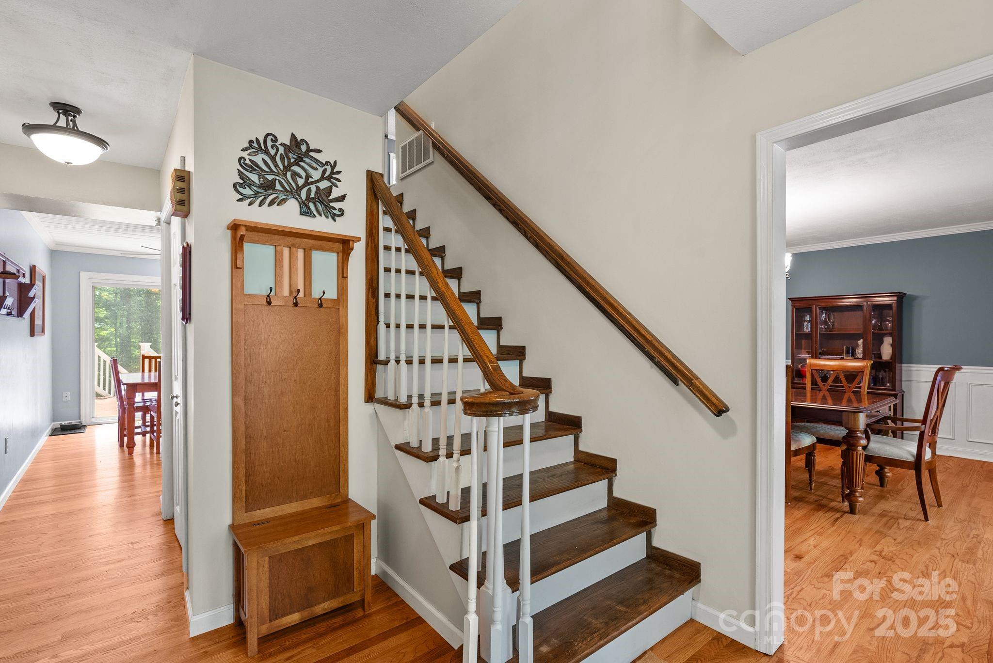 41 Glen Cove Road Arden, NC 28704 - Photo 7 of 39 a view of entryway and hall with wooden floor