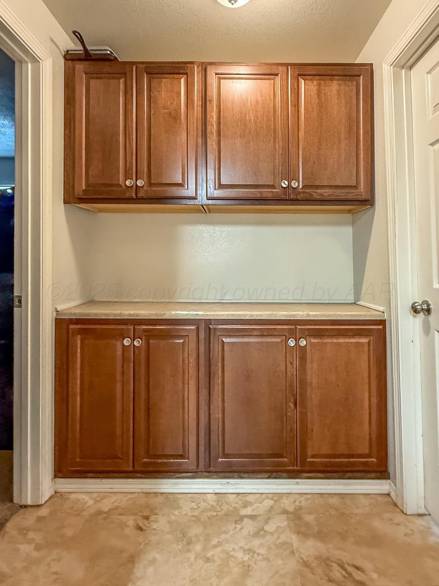 505 North Cedar Street Borger, TX 79007 - Photo 4 of 15 a view of a kitchen with wooden cabinet