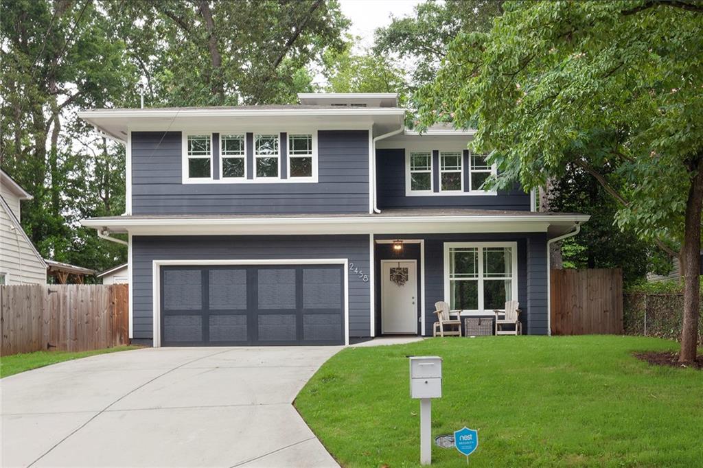 2458 Hillside Avenue Decatur, GA 30032 - Photo 1 of 1 a front view of a house with a garden and yard