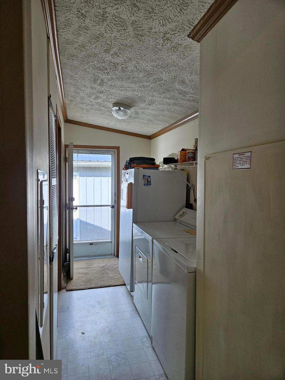 4205 Ridge Crest Road Hurlock, MD 21643 - Photo 12 of 22 Laundry room with freezer, washer & dryer