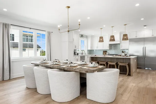 a kitchen with granite countertop a sink appliances and cabinets