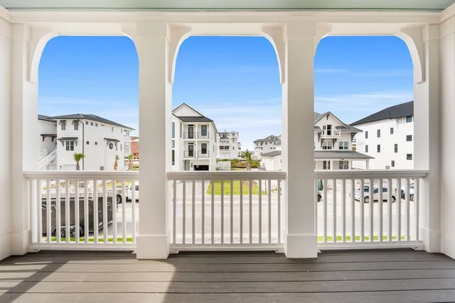 a view of a balcony with wooden floor