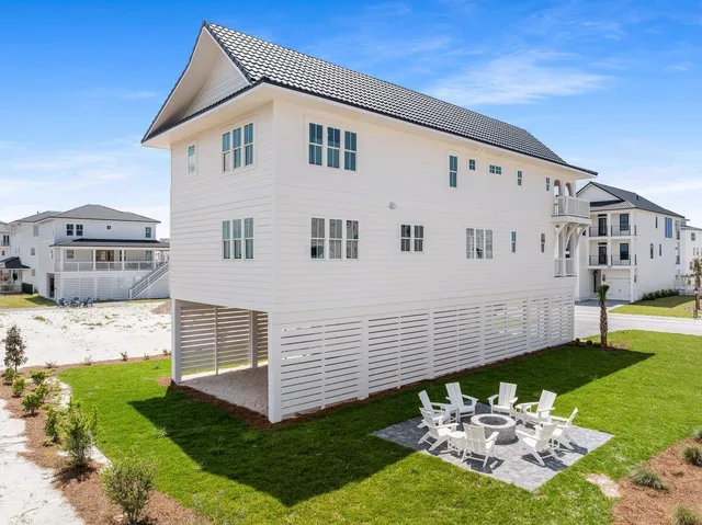 an aerial view of residential houses with outdoor space