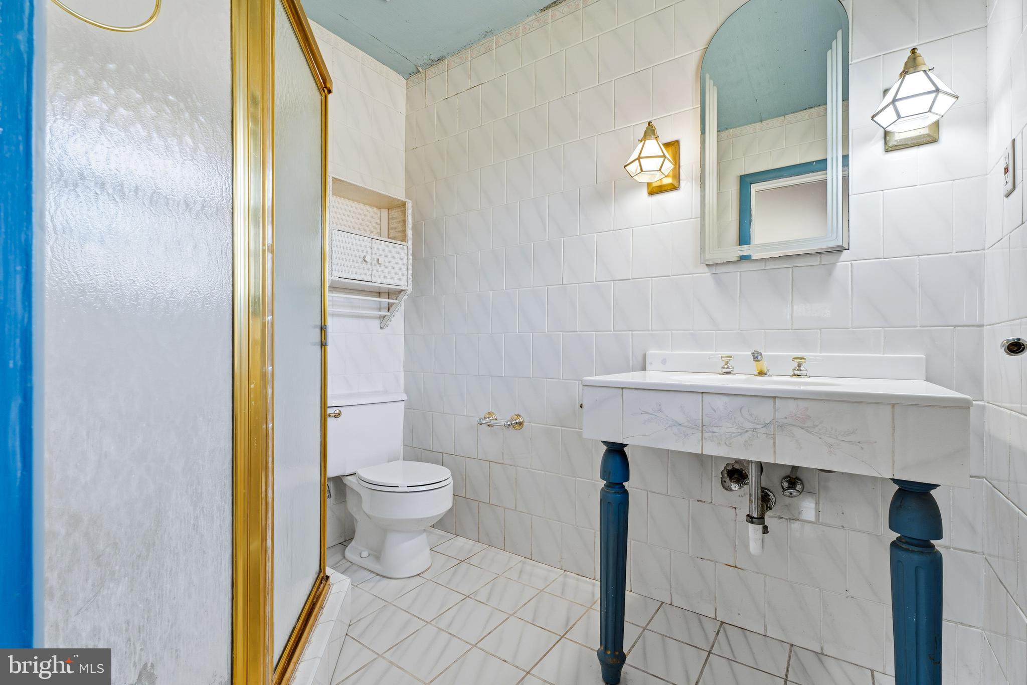 2026 Dumont Road Lutherville-Timonium, MD 21093 - Photo 17 of 41 a bathroom with a sink a toilet and shower