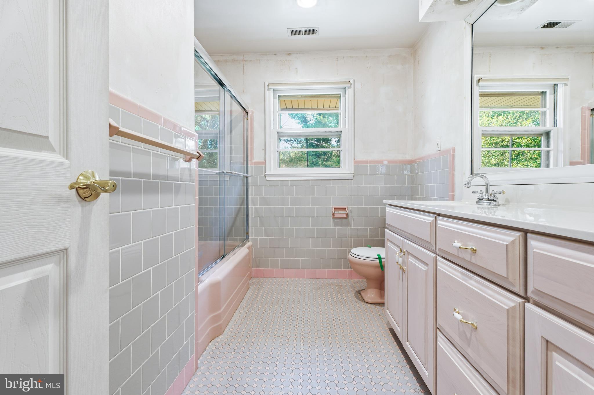 2026 Dumont Road Lutherville-Timonium, MD 21093 - Photo 18 of 41 a bathroom with a double vanity sink toilet and shower