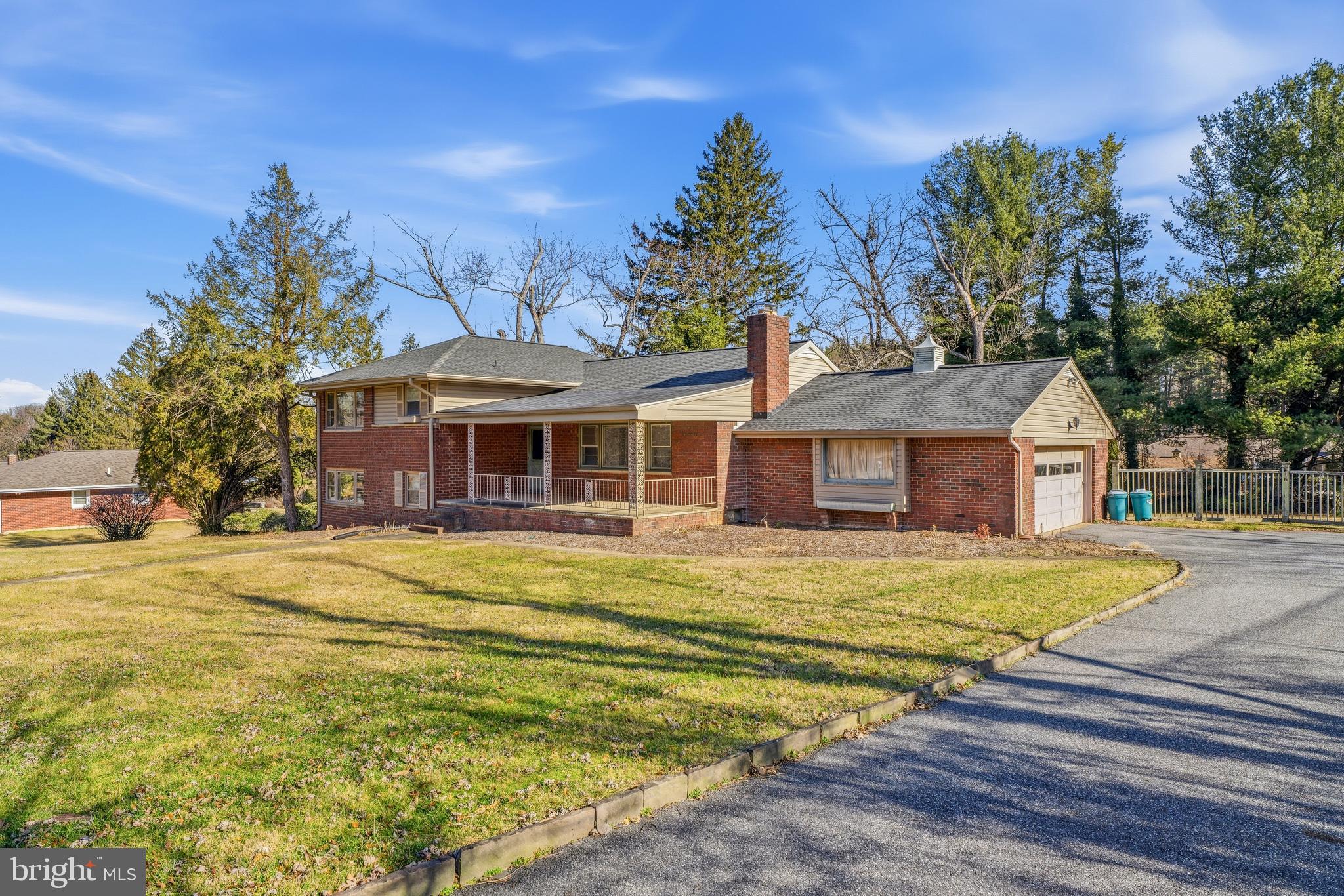 2026 Dumont Road Lutherville-Timonium, MD 21093 - Photo 2 of 41 a front view of a house with a garden