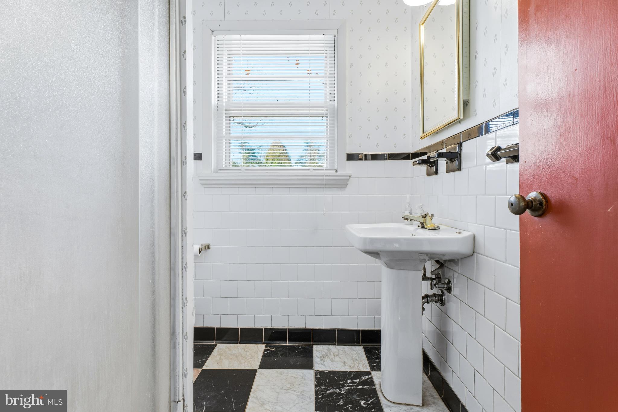 2026 Dumont Road Lutherville-Timonium, MD 21093 - Photo 29 of 41 a bathroom with a sink and a window