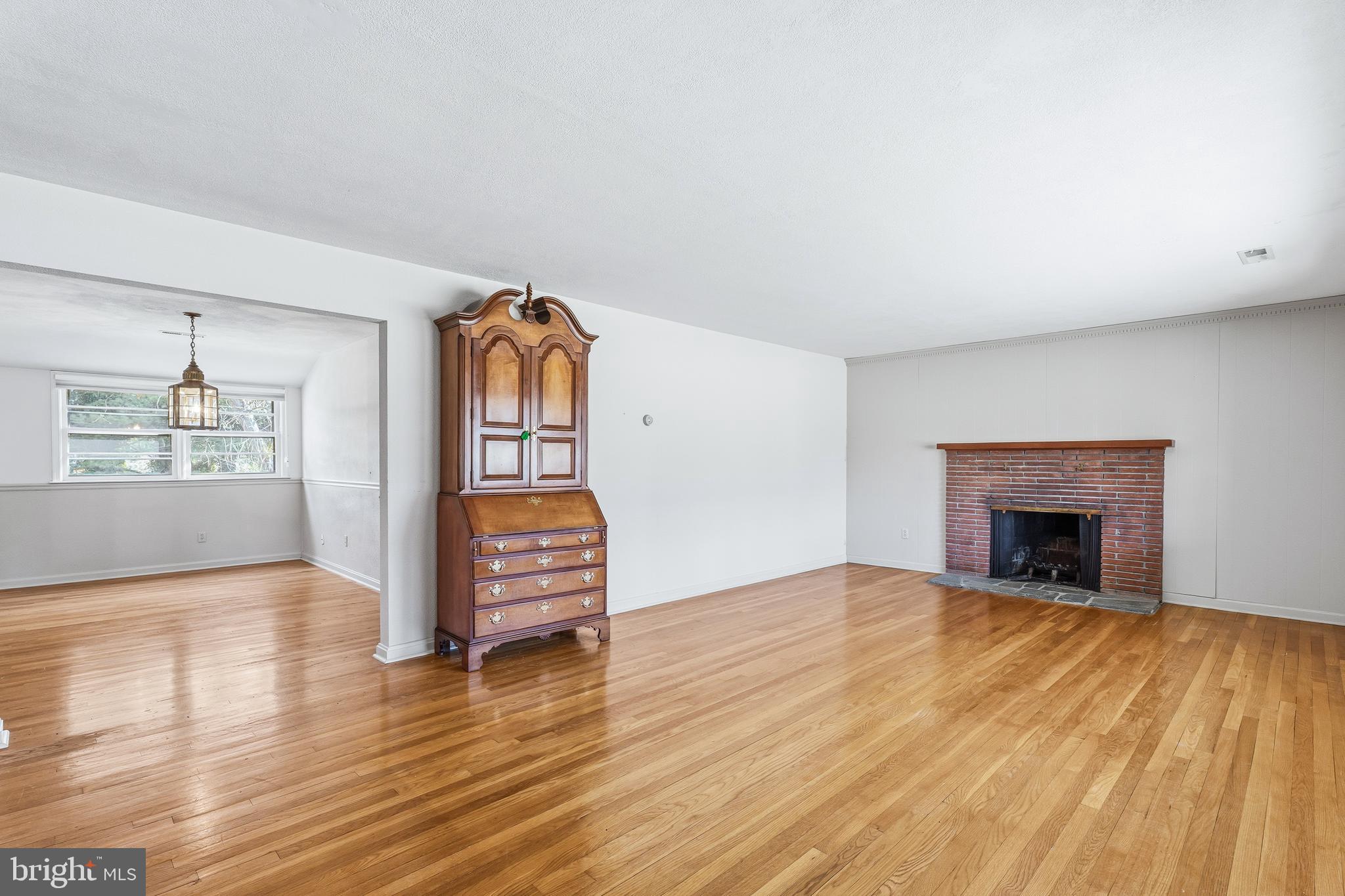 2026 Dumont Road Lutherville-Timonium, MD 21093 - Photo 3 of 41 a view of an empty room with window and wooden floor