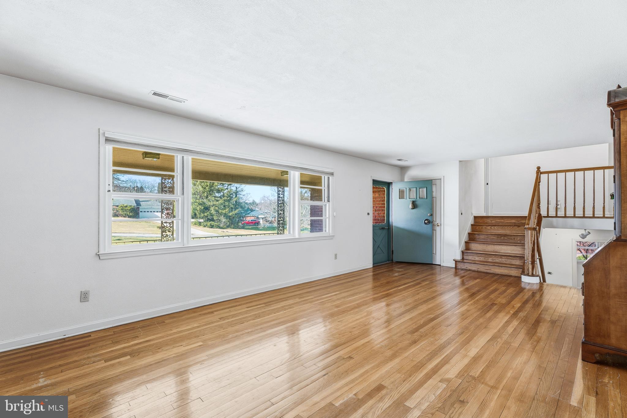 2026 Dumont Road Lutherville-Timonium, MD 21093 - Photo 5 of 41 a view of an empty room with wooden floor and a window