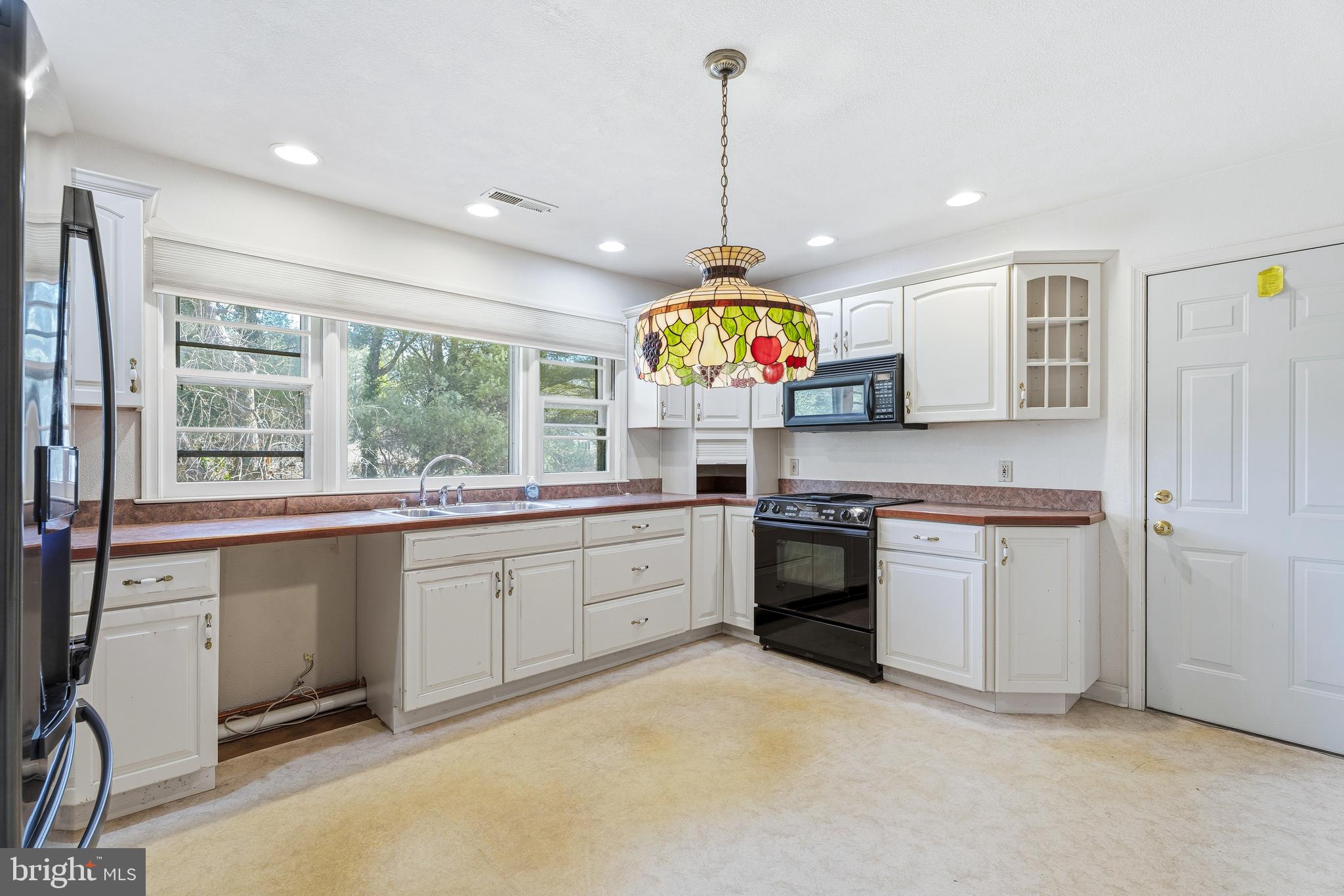 2026 Dumont Road Lutherville-Timonium, MD 21093 - Photo 9 of 41 a kitchen with stainless steel appliances granite countertop a stove and a sink