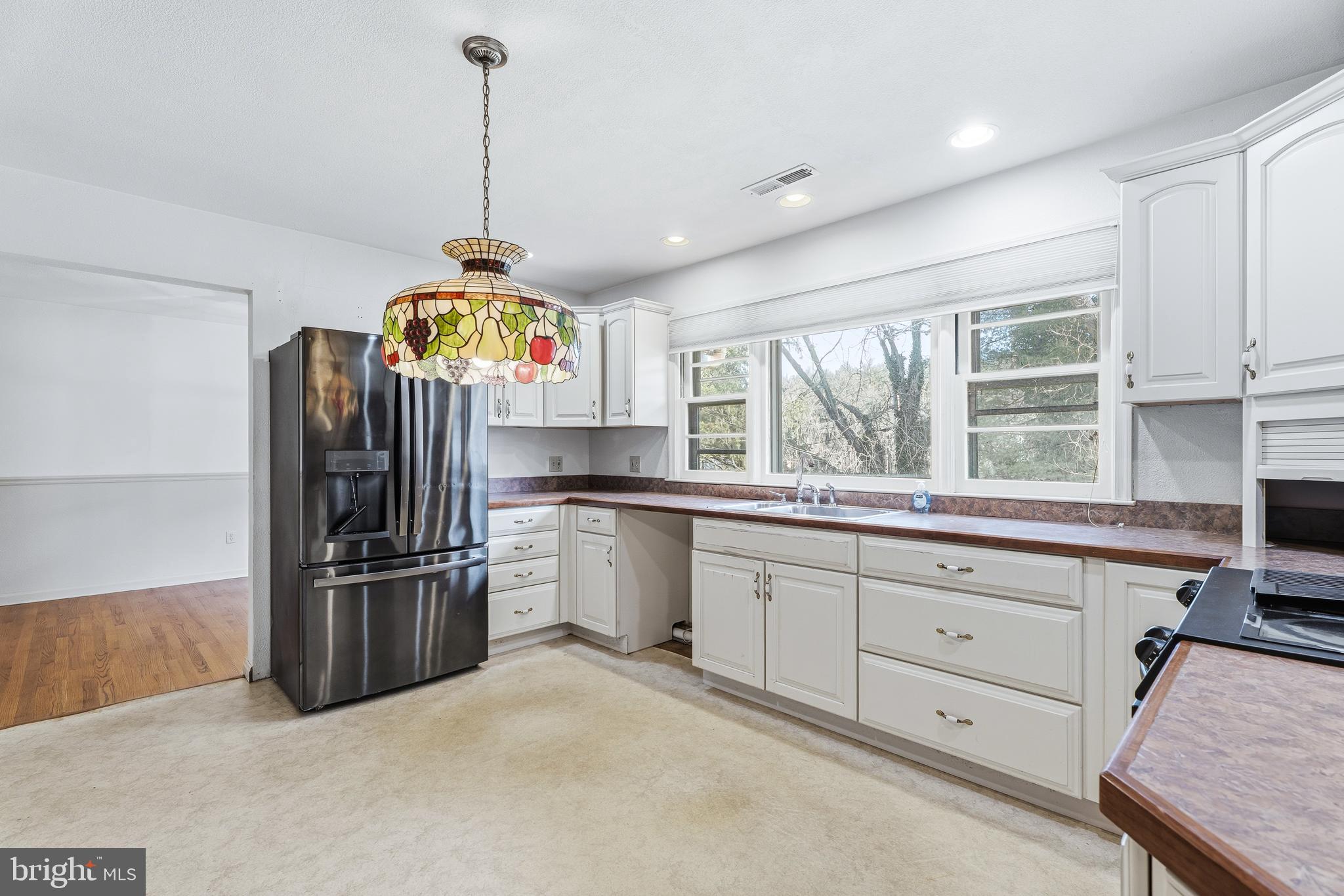 2026 Dumont Road Lutherville-Timonium, MD 21093 - Photo 10 of 41 a kitchen with refrigerator and window
