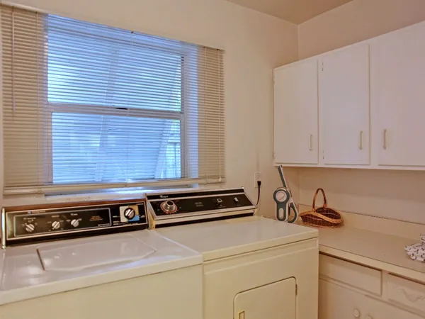 a close view of sink a stove and a microwave oven in a kitchen