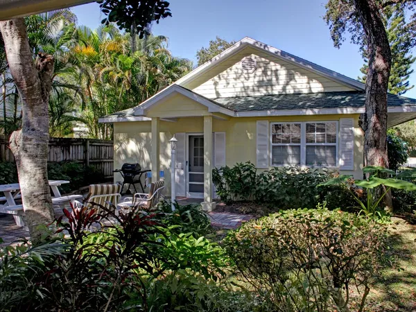 front view of a house with a garden