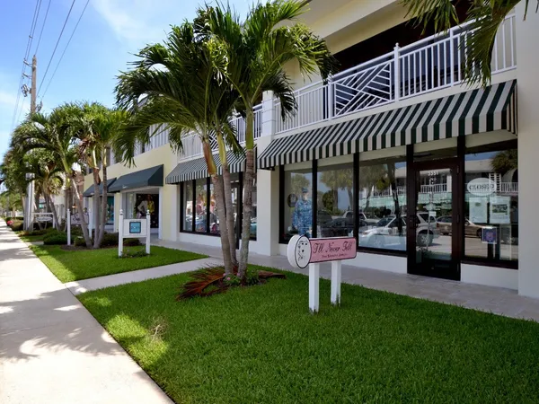 a view of a house with a yard porch and sitting area