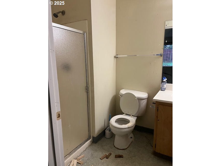 618 Ballad Way Forest Grove, OR 97116 - Photo 4 of 15 a white toilet sitting next to a bathroom sink