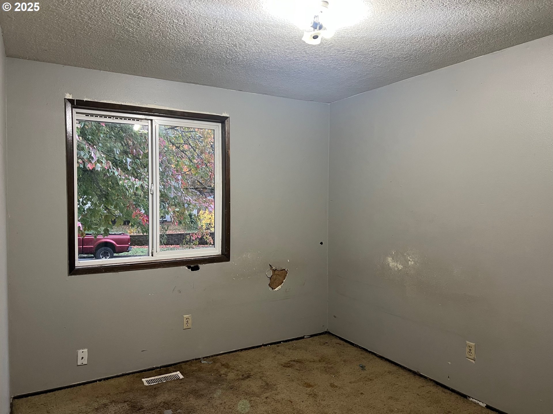 618 Ballad Way Forest Grove, OR 97116 - Photo 5 of 15 an empty room with a window