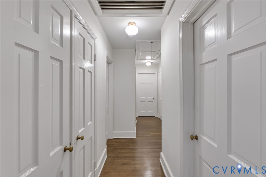 1136 Overbrook Road Petersburg, VA 23805 - Photo 23 of 51 Hallway with wood-finish flooring, white panel doo