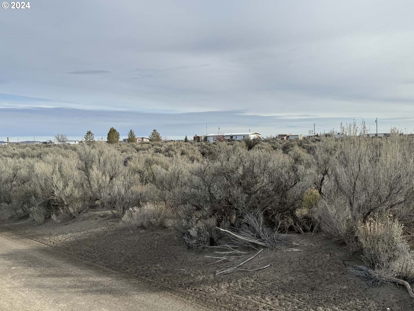 Twighlight Road, Unit TL 4000 Christmas Valley, OR 97641 - Photo 36 of 40 a view of a large building with a view of trees