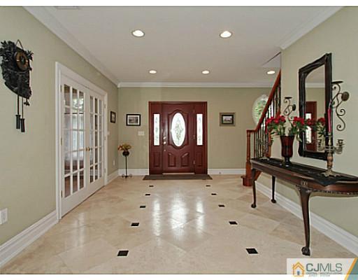 1881 Raritan Road Scotch Plains, NJ 07076 - Photo 2 of 18 a view of a livingroom with furniture and windows